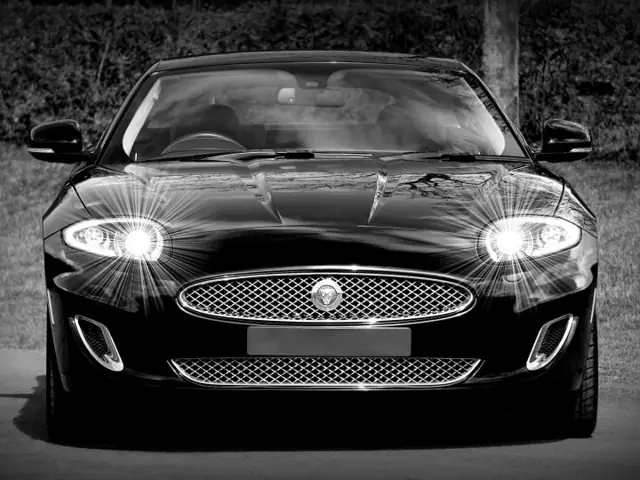 Black sports car gleaming after a wash and wax