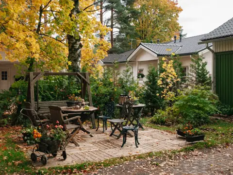 Brick paver patio with table and chairs in autumn